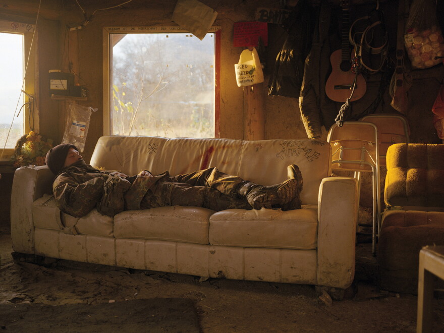 'Sasha' resting. He, as most of the activists, prefers to use a 'forest name' to hide his identity.