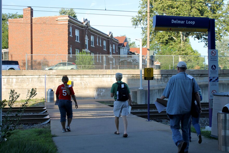 Volunteers look for people experiencing homelessness at the Delmar Loop Metro stop in July 2016 during St. Louis County's summer Point-in-Time count.