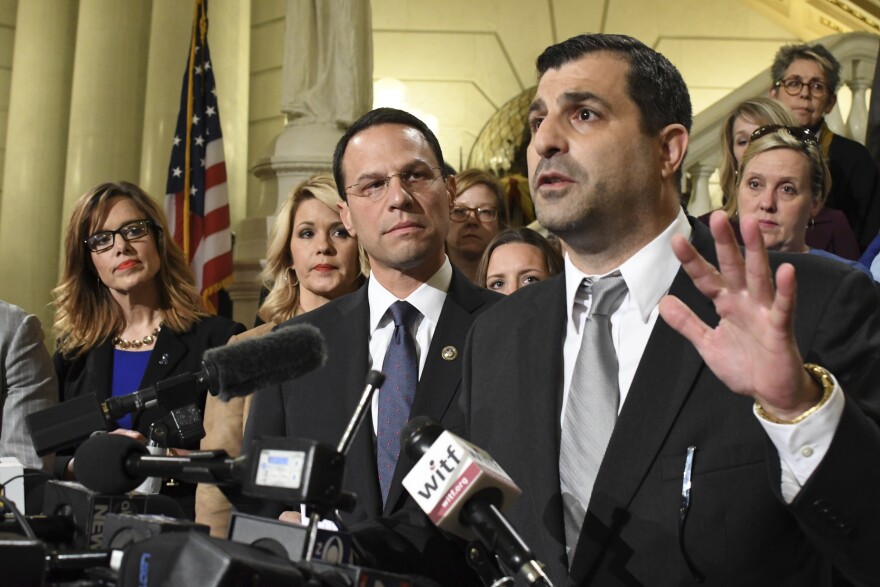 Then-state Rep. Mark Rozzi (D., Berks) speaks at a news conference in the Pennsylvania Capitol in October 2018. He is flanked by then-Attorney General Josh Shapiro, lawmakers, and abuse victims.