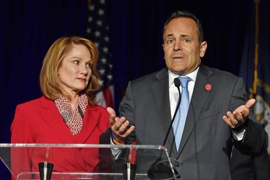 Kentucky Gov. Matt Bevin, with his wife, Glenna, speaks to supporters gathered at the Republican Party celebration event in Louisville, Ky., on Tuesday. Bevin has requested a recanvassing of the gubernatorial election's results.