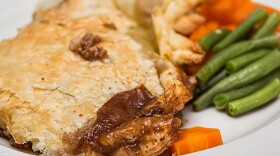 Meat pie and vegetables on a plate