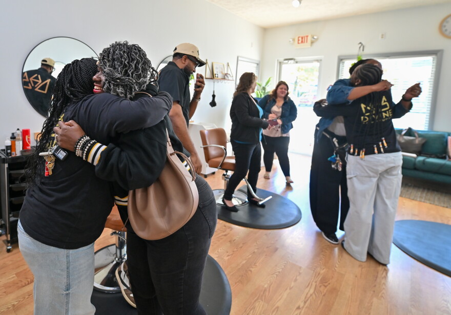 Divine Hair Studios staff hug and thank CCBH staff for stopping in after the completion of Divine's OurHAIR training.