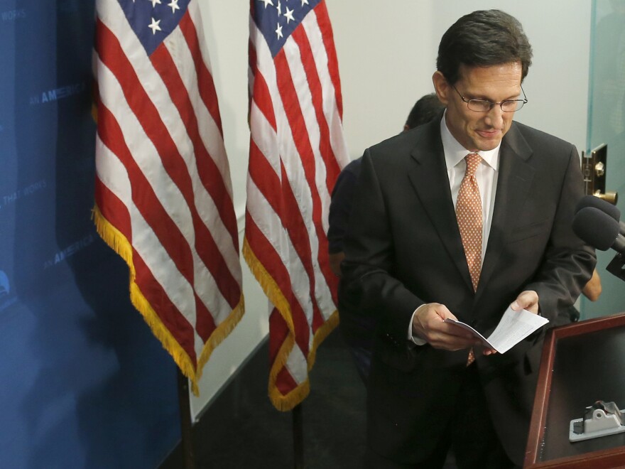 House Majority Leader Eric Cantor of Virginia takes the podium to speak to reporters on Capitol Hill in Washington, on Wednesday. He announced that he would step down as majority leader on July 31.