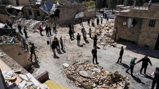 Journalists from foreign media based in Tehran document damage from U.S.-Israeli strikes in a residential area of the town of Fardis, west of Tehran, Iran, Friday, April 3, 2026. (Vahid Salemi/AP)