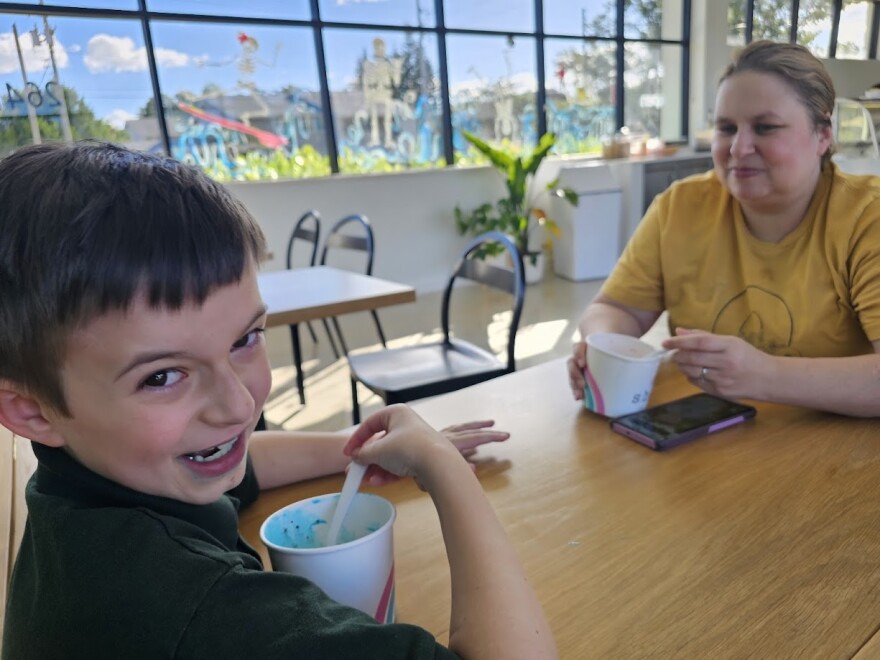 Landon Booth, 10, of Orlando, eats Cookie Monster ice cream with his mother, Erin. The two share a fun moment in a shop near their home. Landon has spent the last three years recovering from cancer, a journey made harder by navigating the state's Florida Healthy Kids Corporation program — a public insurance for children. The problem, however, is that the program was not designed with disabled kids or children with complex medical needs.