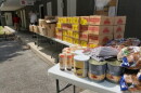 The Salvation Army hosted a drive-thru food distribution, though sunscreen was also included.
