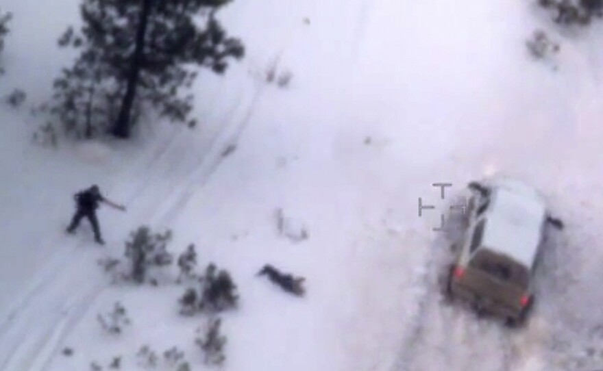 FILE- This Jan. 26, 2016, file photo taken from an FBI video shows Robert "LaVoy" Finicum, center, after he was fatally shot by police near Burns, Oregon. FBI Special Agent W. Joseph Astarita was found not guilty Friday, Aug. 10, 2018, of accusations that he lied about firing at Finicum when officers arrested leaders of an armed occupation of a federal wildlife refuge in rural Oregon. (FBI via AP, file)