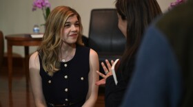 Alexis Meruelo talking to an audience member just after an event at the University of Nevada, Reno.