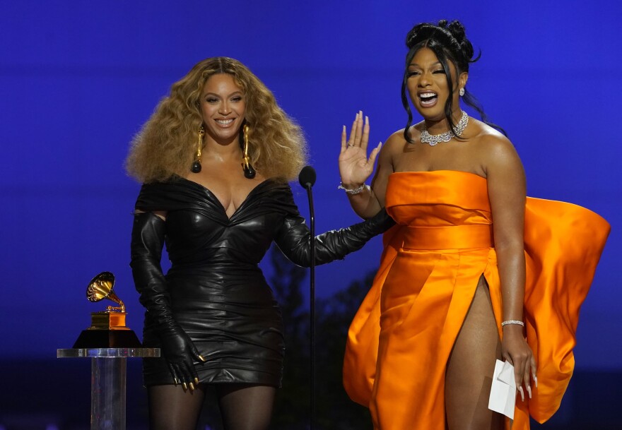 Beyonce, left, and Megan Thee Stallion accept the award for best rap song for "Savage" at the 63rd annual Grammy Awards at the Los Angeles Convention Center on Sunday, March 14, 2021. (Chris Pizzello/AP)