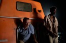 Tom Hanks and Barkhad Abdirahman share close quarters in <em>Captain Phillips</em>.