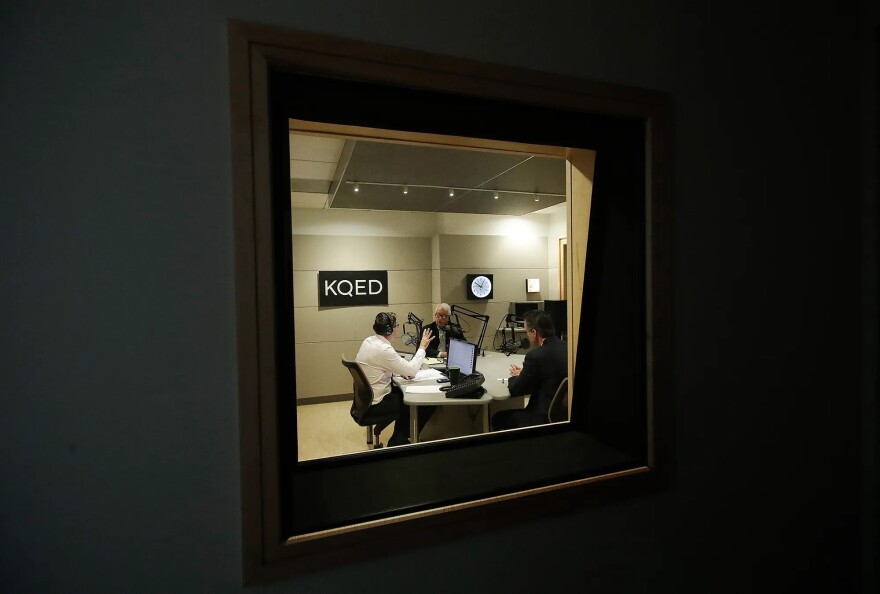Radio host Scott Shafer, left, moderates a California gubernatorial debate between Republican candidate John Cox, center, and Democratic candidate Gavin Newsom at KQED Public Radio Studio in San Francisco, on Oct. 8, 2018. The NPR station is among many in California hit by Republican congressional cuts to the Corporation for Public Broadcasting.
