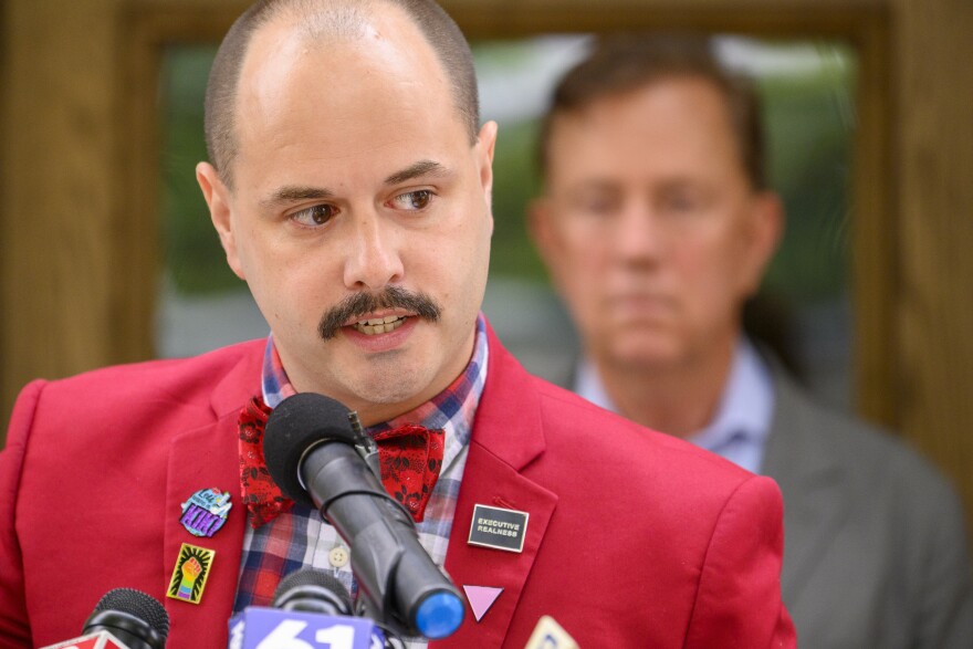 Patrick Dunn, executive director of the New Haven Pride, speaks outside Hartford’s InterCommunity Health Care center during a press conference aimed a dispelling misinformation about how monkeypox is spread.