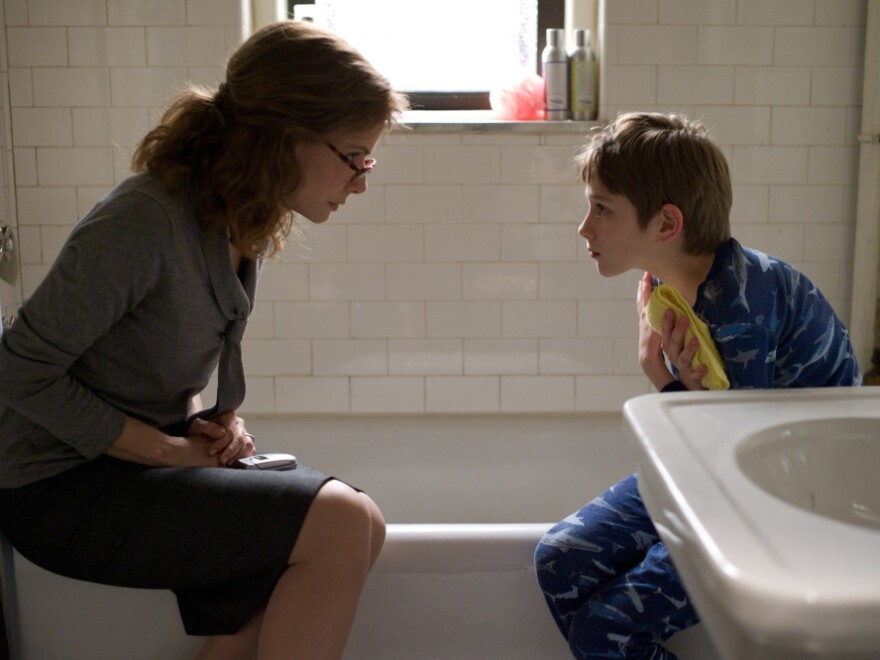 Oskar lies to his mother, played by Sandra Bullock, about a series of phone messages left by his father on the morning of Sept. 11, 2011.