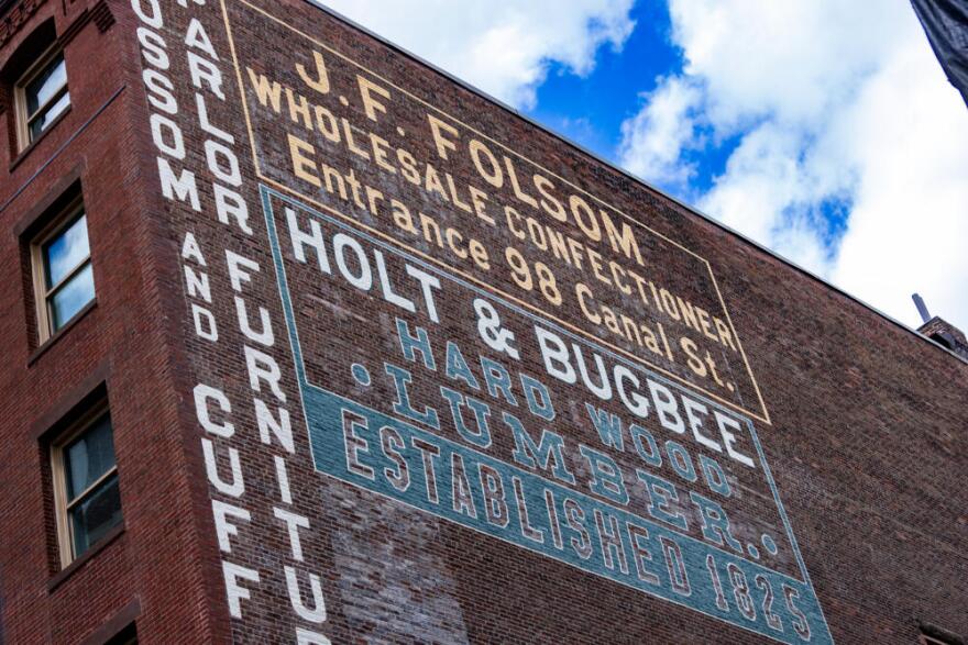 The restored Holt & Bugbee lumber company sign in the West End of Boston. (Jesse Costa/WBUR)