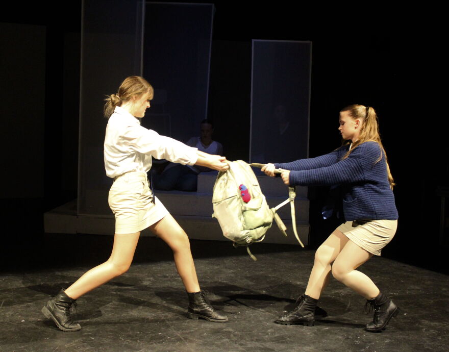 Conor's best friend, Lily (right, played by Aubrey Wilson) in tug of war with one of Conor's bullies, Sully, played by Liv Schiller.