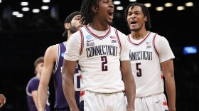 UConn guard Tristen Newton (2) and guard Stephon Castle (5) react during the first half of a second-round college basketball game against Northwestern in the NCAA Tournament, Sunday, March 24, 2024, in New York. (AP Photo/Mary Altaffer)