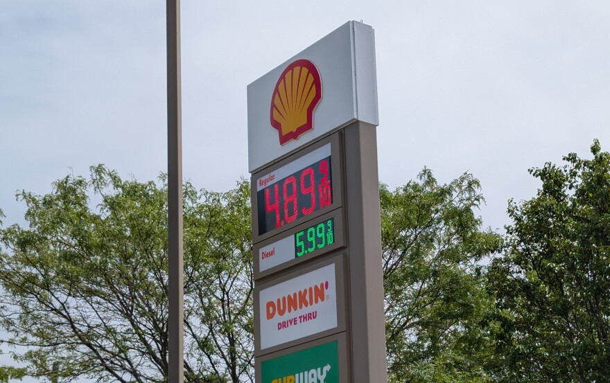 A gas station sign advertises unleaded for $4.89 a gallon.