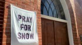 FILE: A "pray for snow" banner hangs outside a church on Park City's Park Avenue.