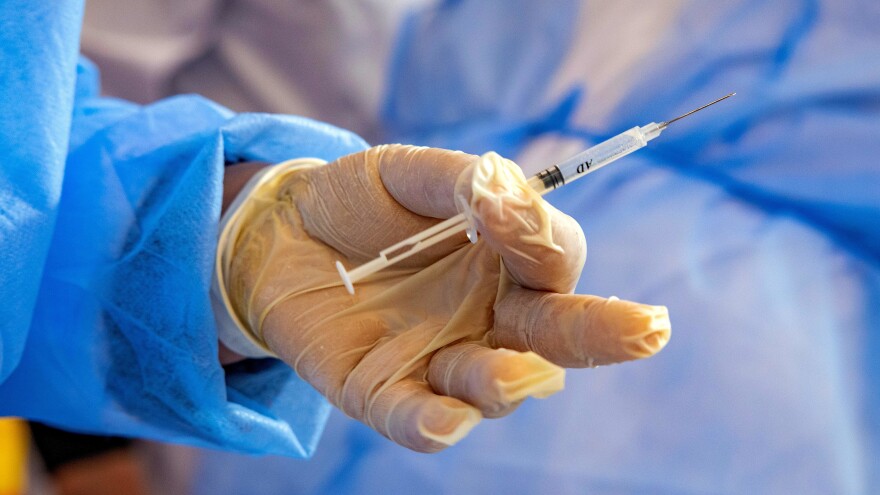 A Moroccan nurse holds a syringe containing a dose of the COVID-19 vaccine on Jan. 29. Morocco is one of the many countries that will receive COVID-19 doses as part of the COVAX initiative.