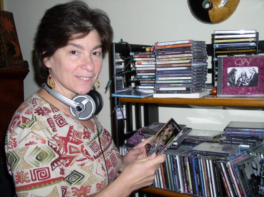 Sharon Ettinger listens to CDs.