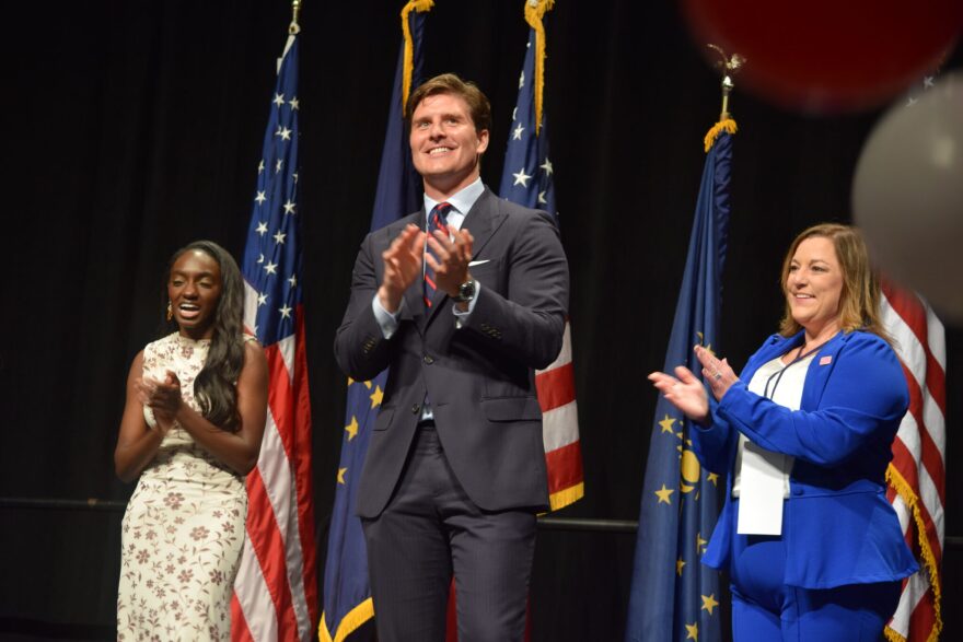 Beau Bayh celebrates after winning the Democratic secretary of state nomination at the Indiana Democratic Convention on Saturday, June 6, 2026, in Indianapolis. The party also formally nominated Coumba Kebe, left, for state treasurer, and Jessica Bailey, right, for state comptroller.