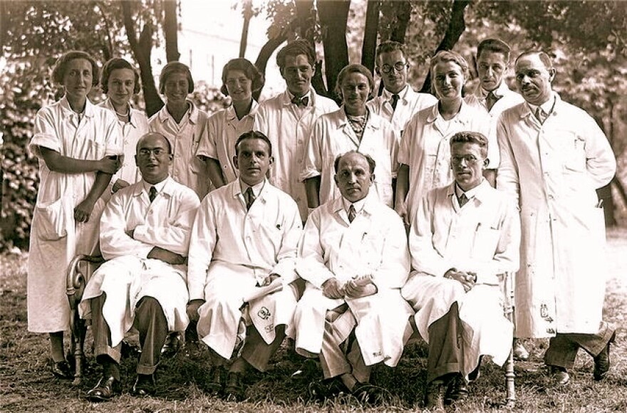 Asperger, in the bottom row, far right, with other staff members at the Children's Clinic, realized in the 1930s that autism was a spectrum of disorders that conferred both disability and ability.