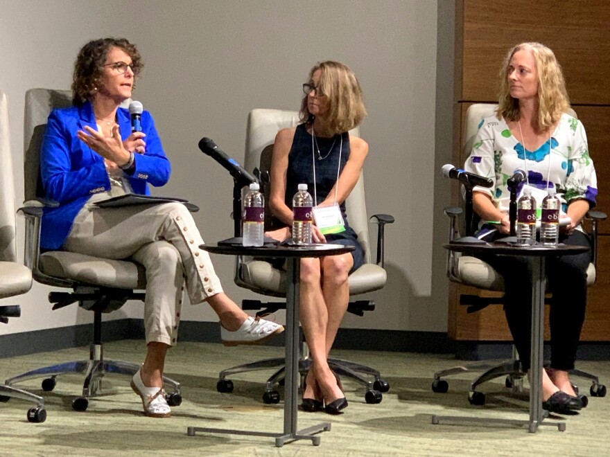 USF professor Dr. Marissa Levine (l) talked about the importance of acknowledging how a history of social injustices contributed to certain populations being more vulnerable to climate change today.