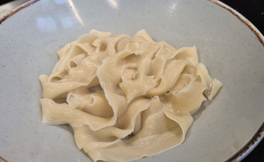 The resultant bowl of flat noodles