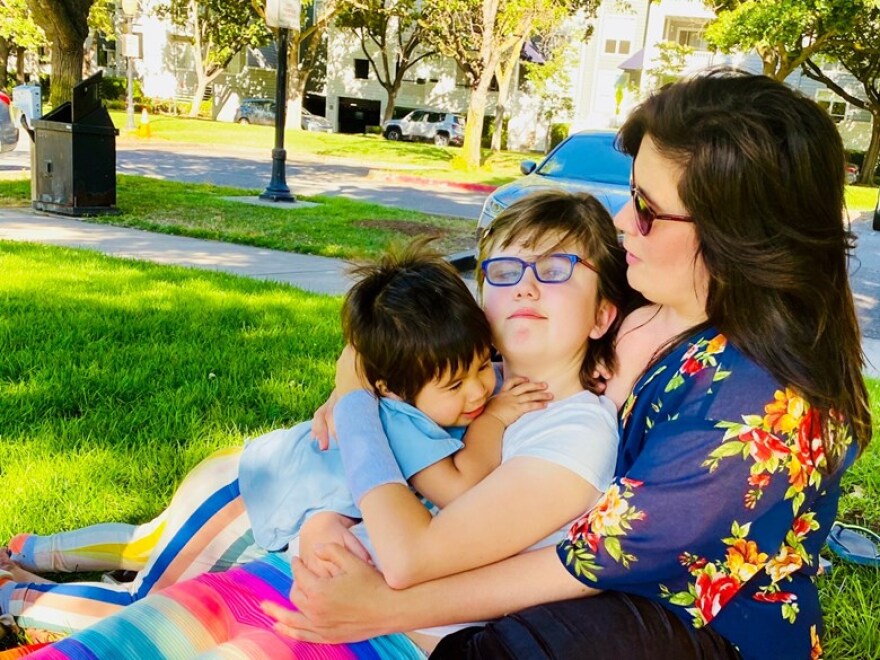 Natalia, Iolani and JoAnna Van Brusselen. Iolani, 11, has cerebral palsy and is starting 6th grade remotely.