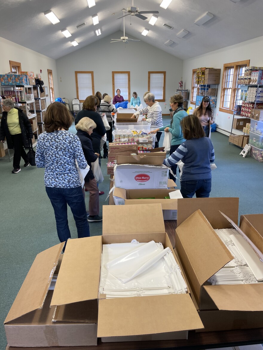 Volunteers packing at Cape Kid Meals headquarters in Cotuit.