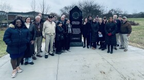 Mayor Linda Gorton, city council members, and inductees to the Kentucky Veterans Hall of Fame flank a new memorial in Lexington.