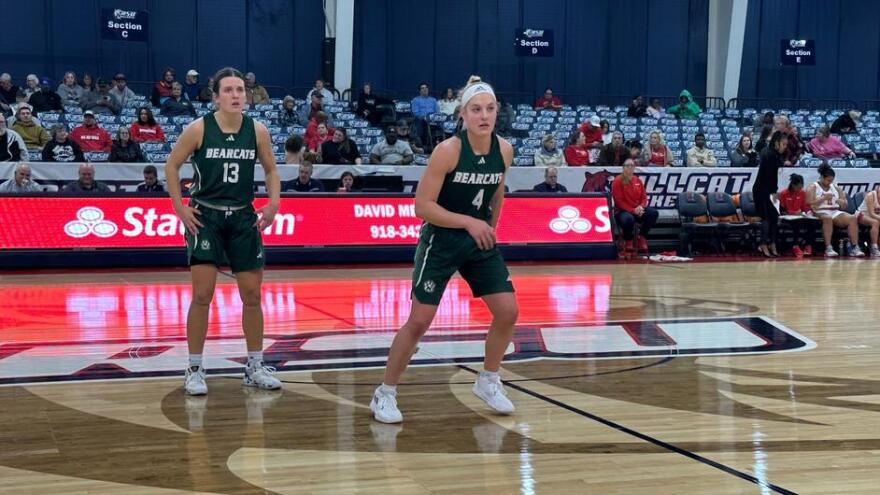 Action shot of Lindsey Kelderman and Caely Kesten vs Rogers State basketball
