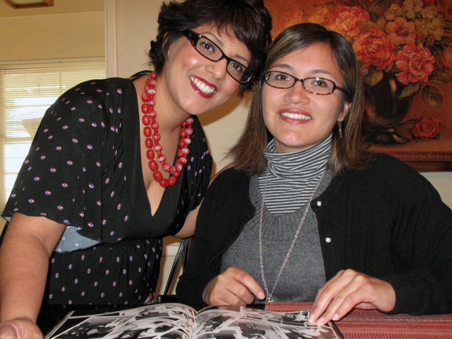 Dolores Arredondo (left) and Alicia Barrera look over their 1991 yearbook from Garfield High School.  "Even if you weren't his student, he would always ask you, 'How're you doing in trig? What’s happening with your grades?'" Arredondo says.