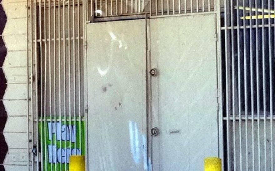 The doors are padlocked at the Zeba #-2 Food Mart, where the fatal robbery attempt took place.