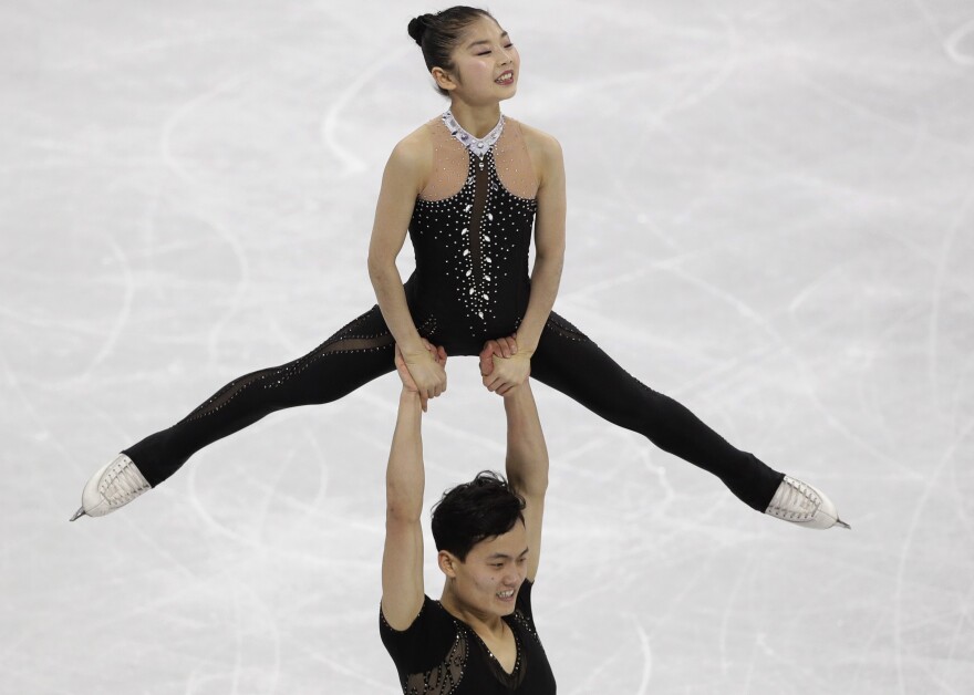 North Korea's Kim Ju Sik lifts Ryom Tae Ok during the pairs free skate final at Gangneung Ice Arena. The pair scored a personal best of 193.63 and finished 13th in their Olympic debut.