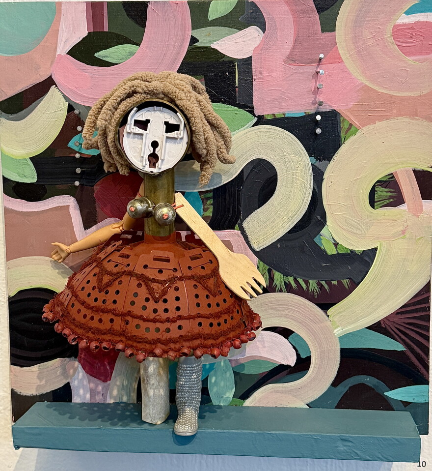 Female figure made of vegetable steamer skirt, bone legs and Barbie boot