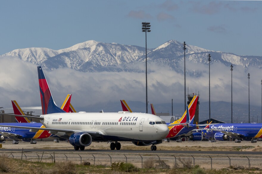 A Delta Air Lines jet seen parking at Southern California Logistics Airport (SCLA) in March 2020, in Victorville, Calif.