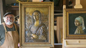 Tomas Bustos with his work, “Masterpiece: Relief for the Blind”