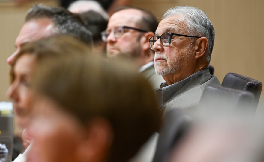 Members of Archbald Borough Council, including President Louis Rapoch, in focus, listen to public comment.