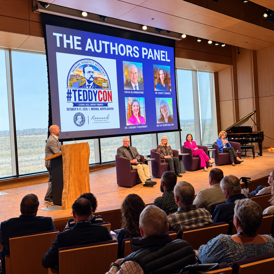 Michael Patrick Cullinane introduces moderator Craig Blumenshine and historians Kathleen Dalton, Lindsay Chervinsky and Stacy Cordery at the Theodore Roosevelt Presidential Library during TeddyCon on Friday, Oct. 9, 2026.