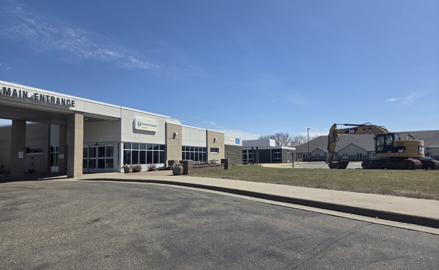 An excavator sits outside the Essentia Health hospital in Fosston on April 20, 2026, ahead of an emergency room expansion project. The project is expected to be complete by summer 2027.