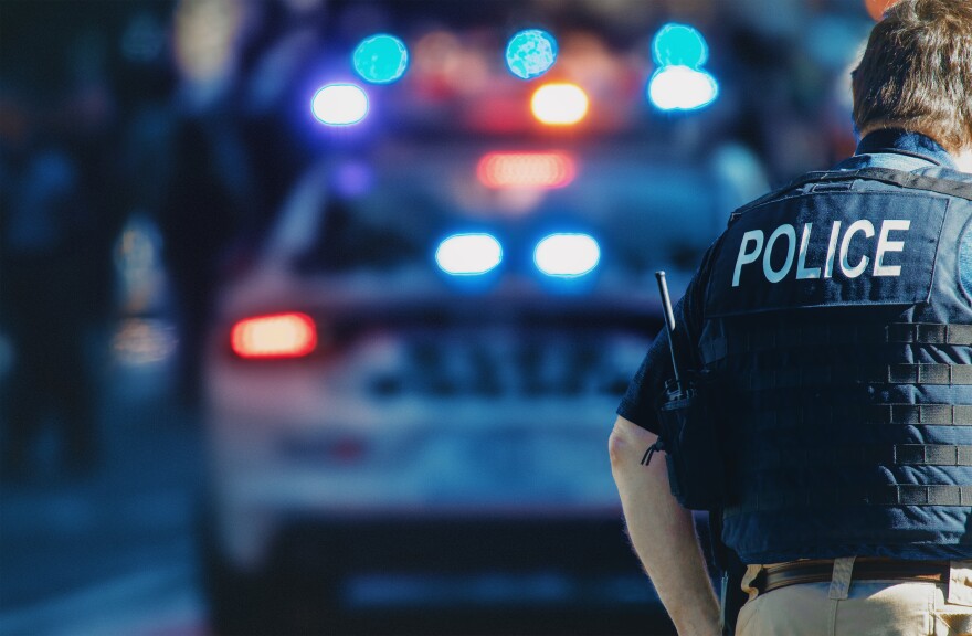 Manhattan 2019. Behind the police with gun belt, close up