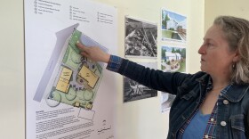 Amanda Holmes points to site plans for the new Fishtown Preservation Society office. (Photo: IPR News)