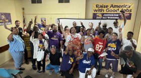 Members of the SEIU Local 1, which agreed to a new three-year contract, pose for a photo.