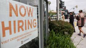 A 'Now Hiring' sign is displayed outside a resale clothing shop on June 2, 2023 in Los Angeles, California. Today’s U.S. labor report shows that employers added 339,000 jobs in May with sectors including construction, healthcare, business services and transportation adding jobs with wages showing 4.3 percent growth over the same period last year. (Mario Tama/Getty Images)