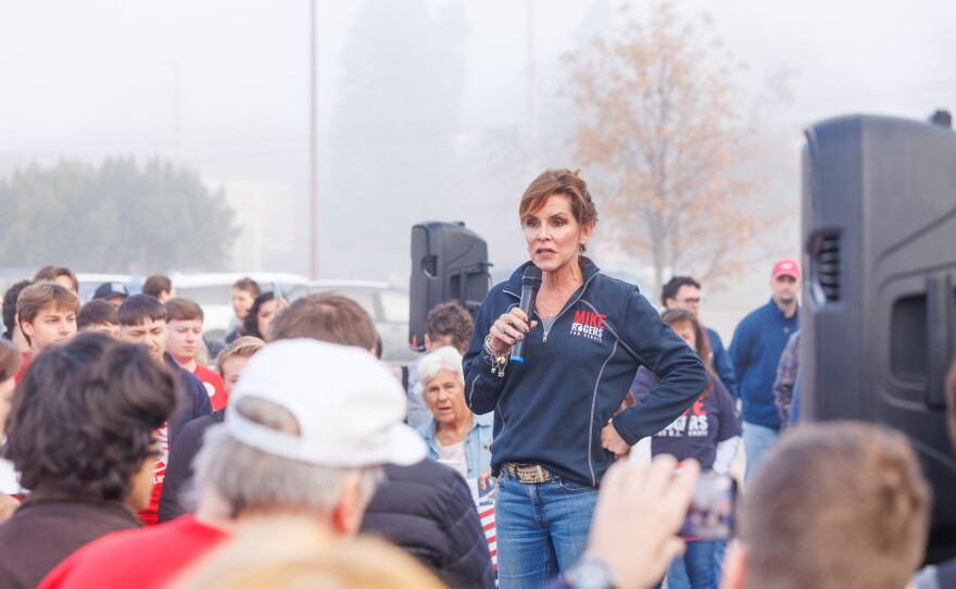 Kristi Rogers, wife of Republican U.S. Senate nominee Mike Rogers, speaks in Lansing Township, Mich., on Oct. 24, 2026, during a stop on Rogers' "We Have a State to Save" bus tour.