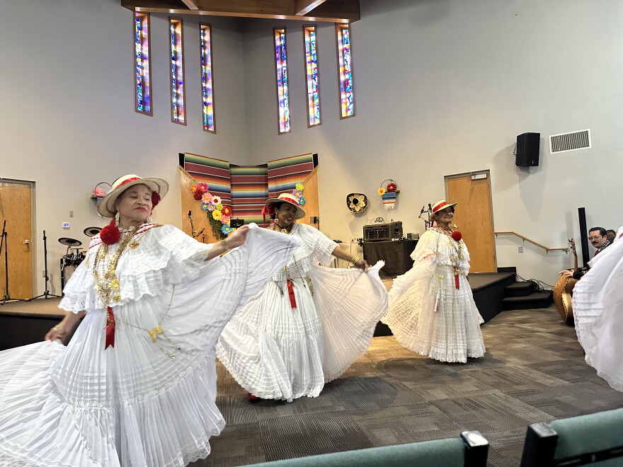 Women in white dresses dancing