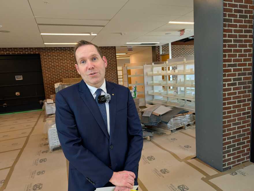 Suffolk Public Library Director Clint Rudy tours the in-progress Downtown Suffolk Library.