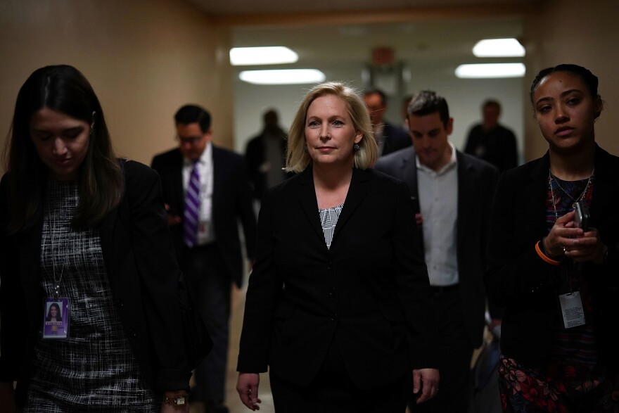 Sen. Kirsten Gillibrand, D-N.Y. (C) leaves after a news conference Tuesday on Capitol Hill in Washington, D.C.