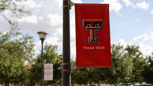 A Texas Tech University banner hangs from a light pole on the university’s campus in Lubbock, Texas.
